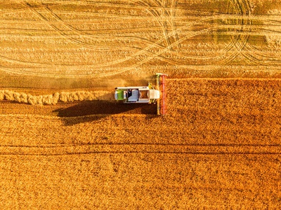Harvester machine working in field, LALS Stock | Shutterstock Harvester machine working in field, LALS Stock | Shutterstock